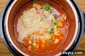 Hearty Quinoa and Vegetable Stew Recipe 4 Quinoa added to pressure cooker pot to create our vegetable stew