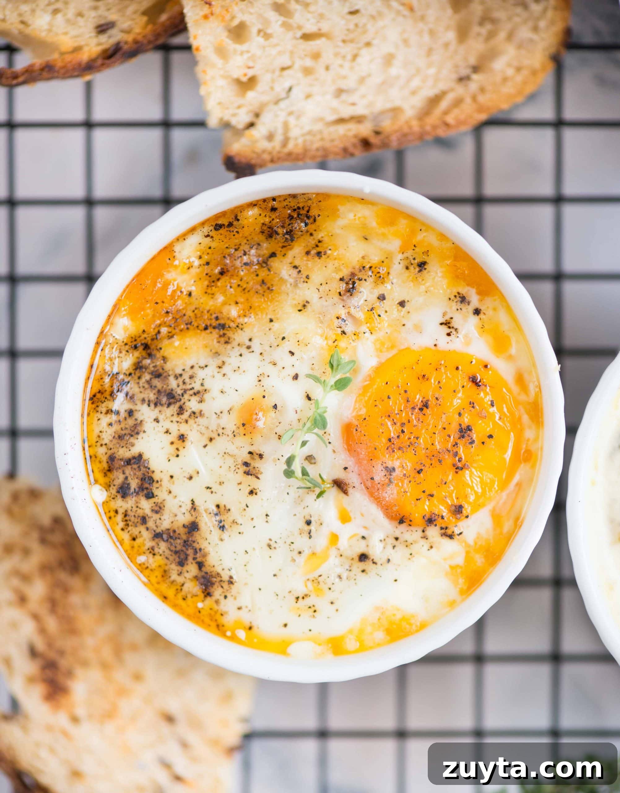 How to Make Shirred Eggs: Baked Egg Recipe 2 These baked eggs with creamy gooey eggs fit perfectly as a quick breakfast or snack.