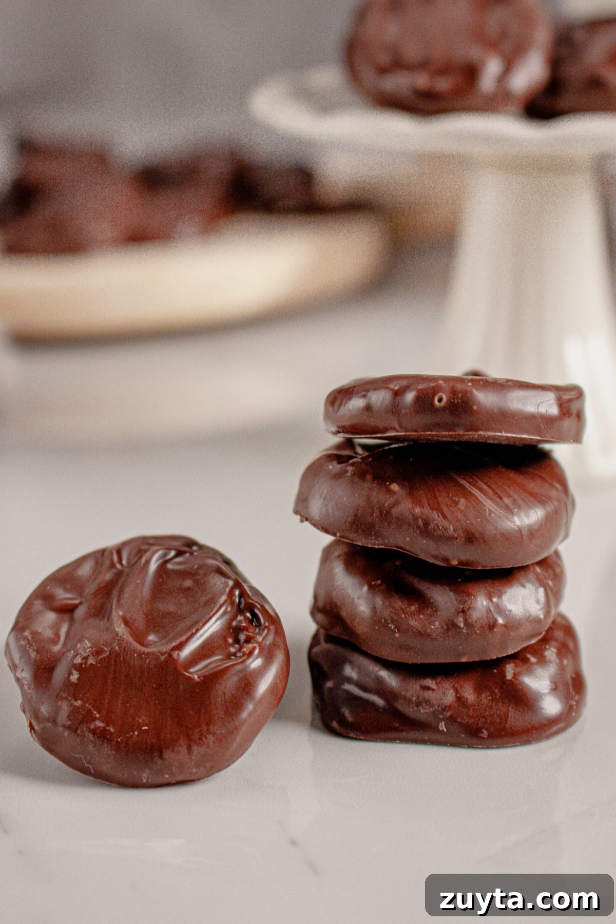 Peppermint patties stacked on a counter.