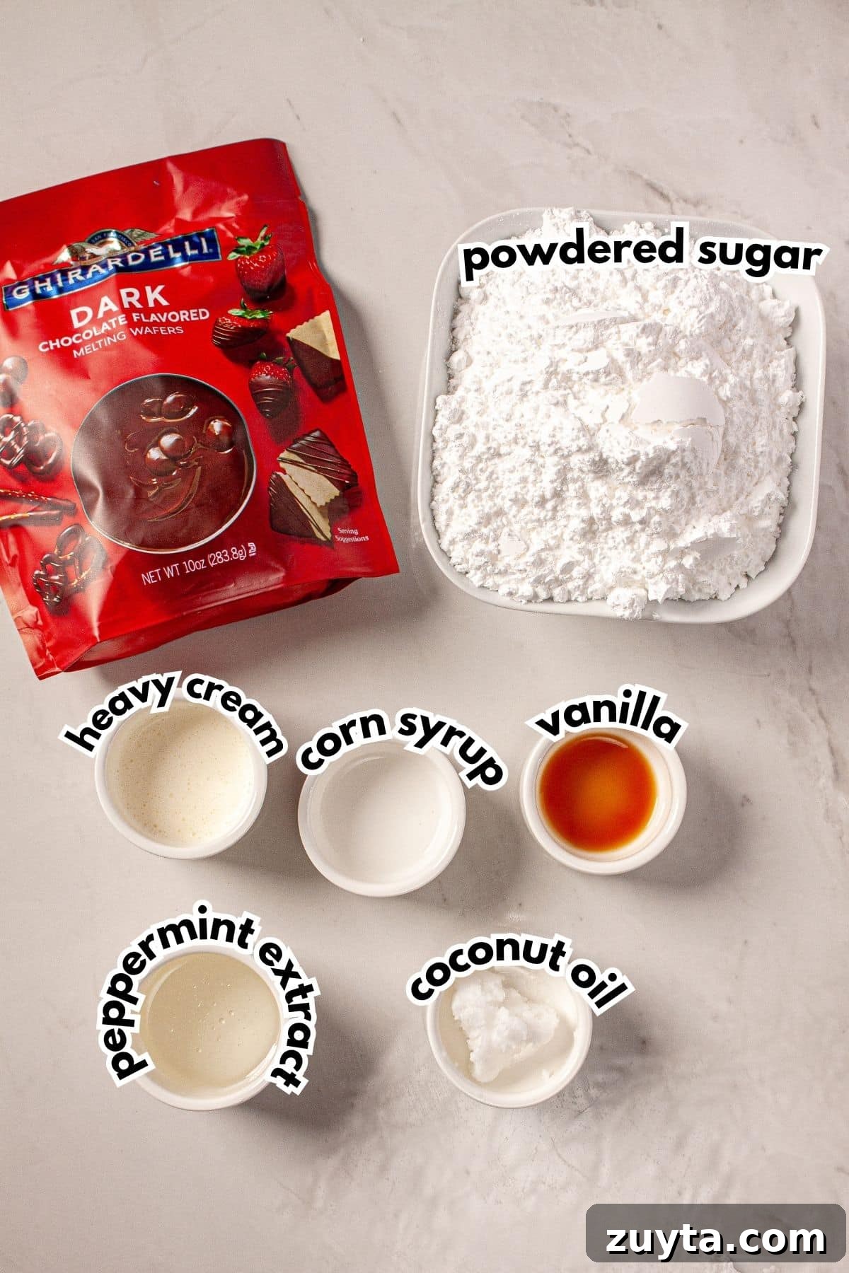 Bowls of ingredients labelled with text on a counter.