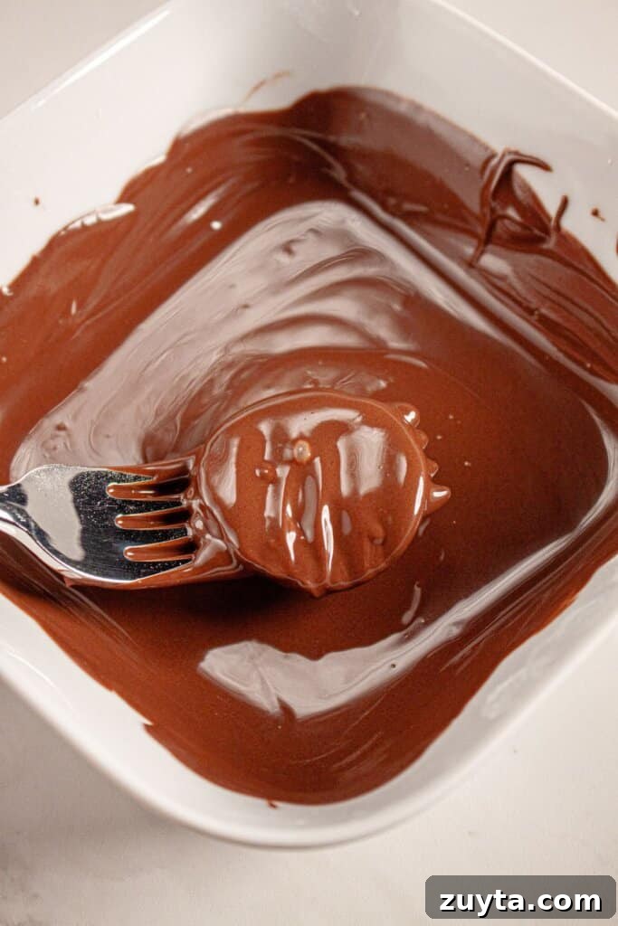 Filling being dipped in chocolate.