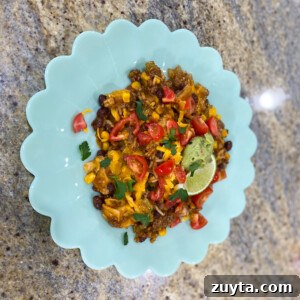 Enchilada skillet with melted cheddar cheese and vegetables
