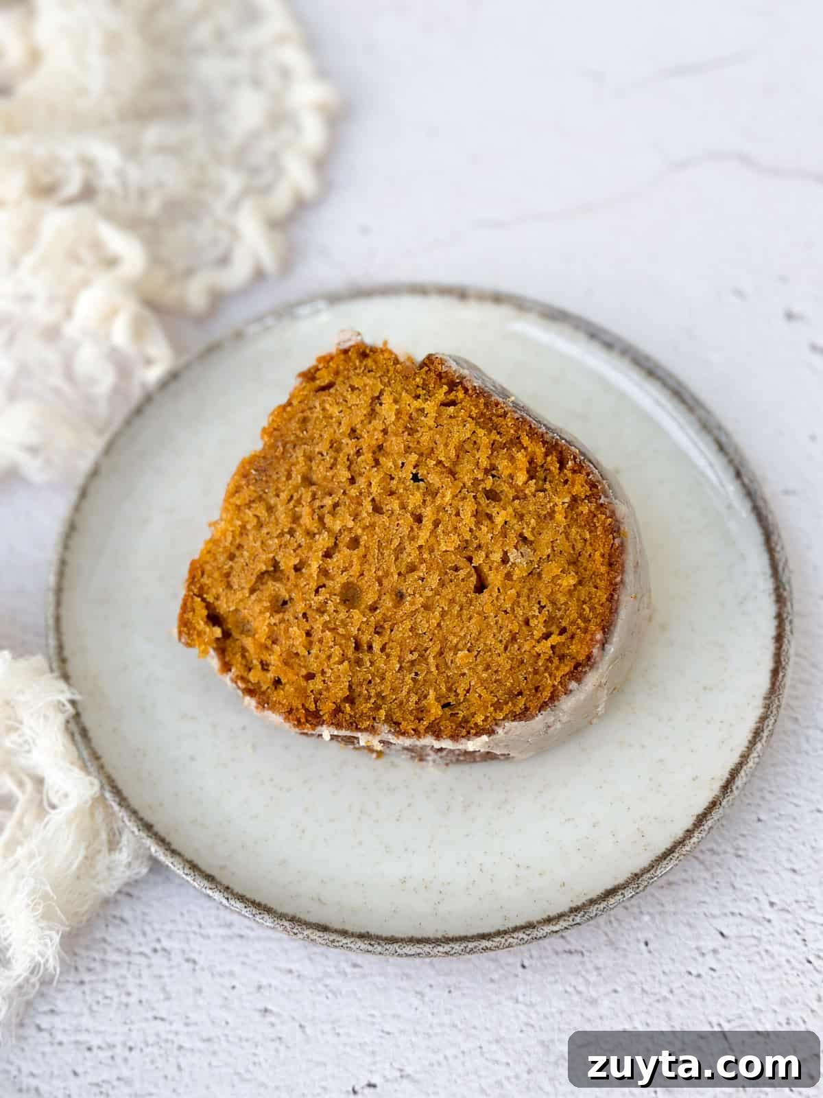 Moist Pumpkin Bundt Cake Recipe with Cinnamon Glaze 12 a whole slice of pumpkin bundt cake.