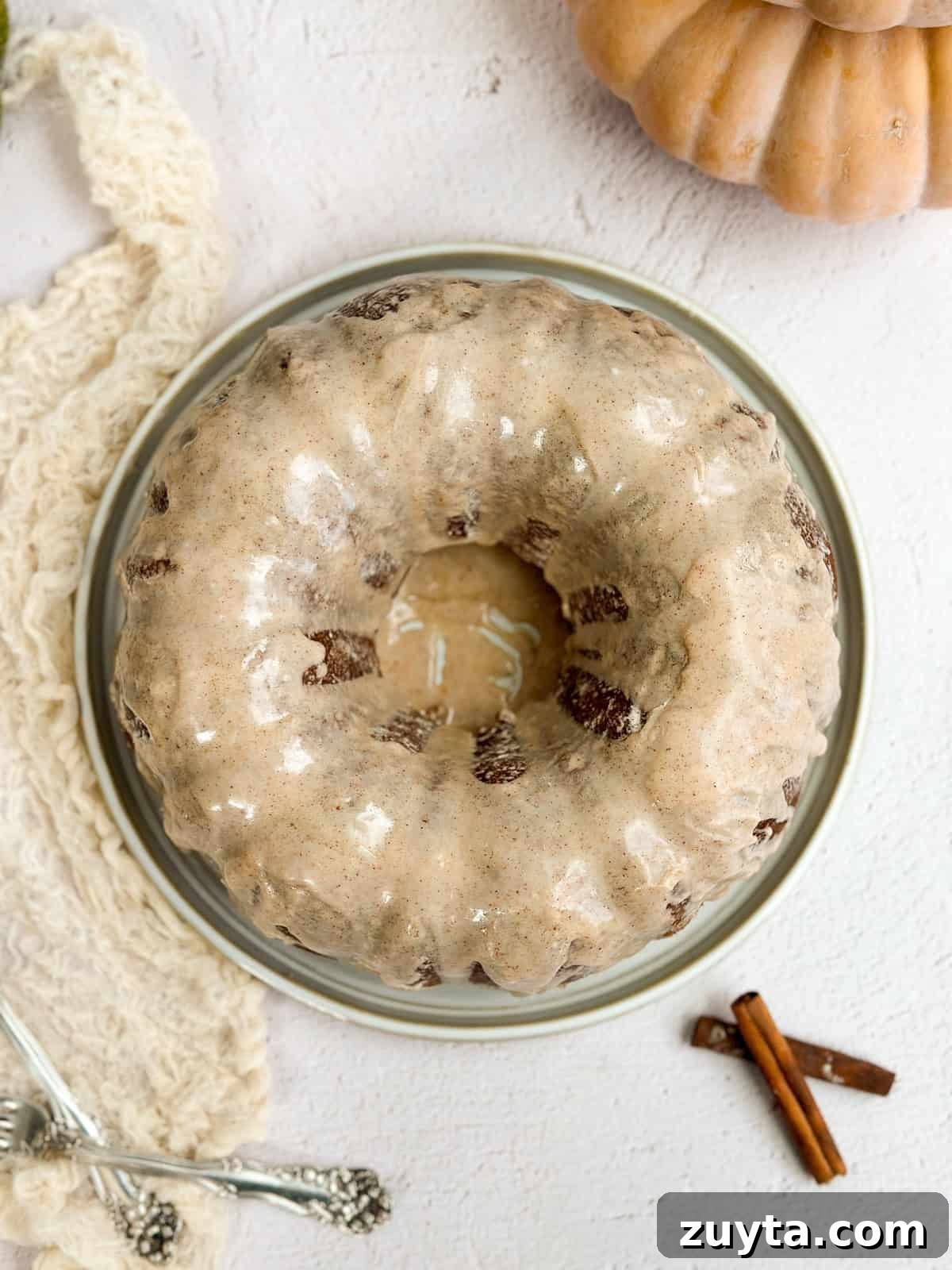 Moist Pumpkin Bundt Cake Recipe with Cinnamon Glaze 10 the pumpkin bundt cake with the glaze drizzled on top.