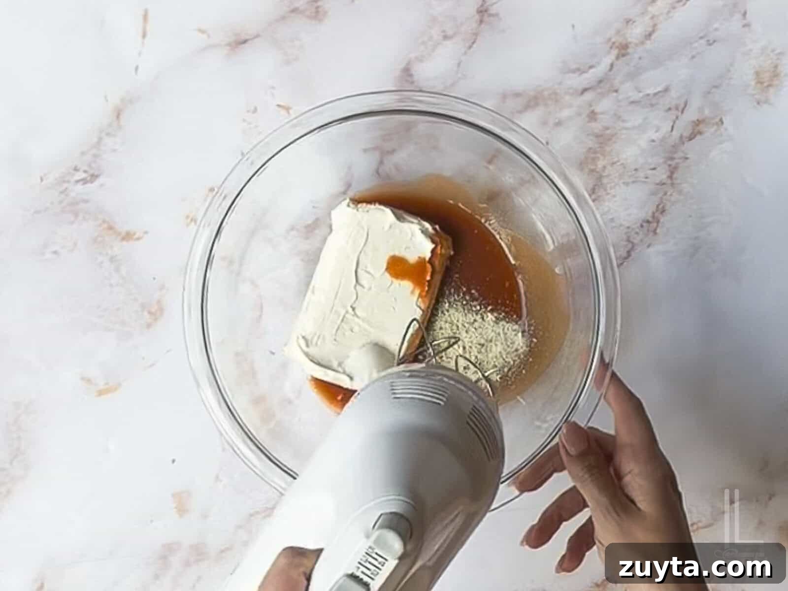 Buffalo Chicken Pinwheels Appetizer Recipe 5 using a hand mixer to blend hot sauce, cream cheese, and ranch.