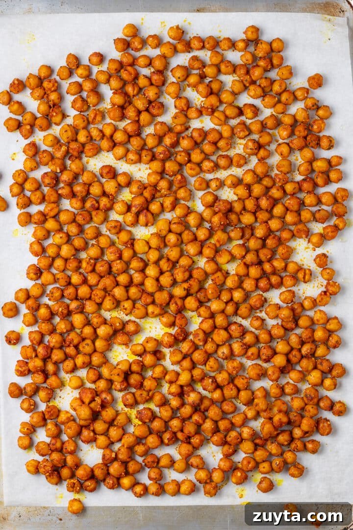seasoned and roasted chickpeas on a sheet pan
