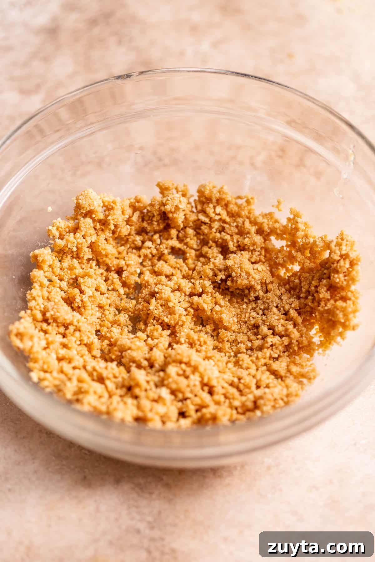 Pumpkin Cheesecake Cookies Recipe 5 A glass bowl with the graham cracker crumbs.