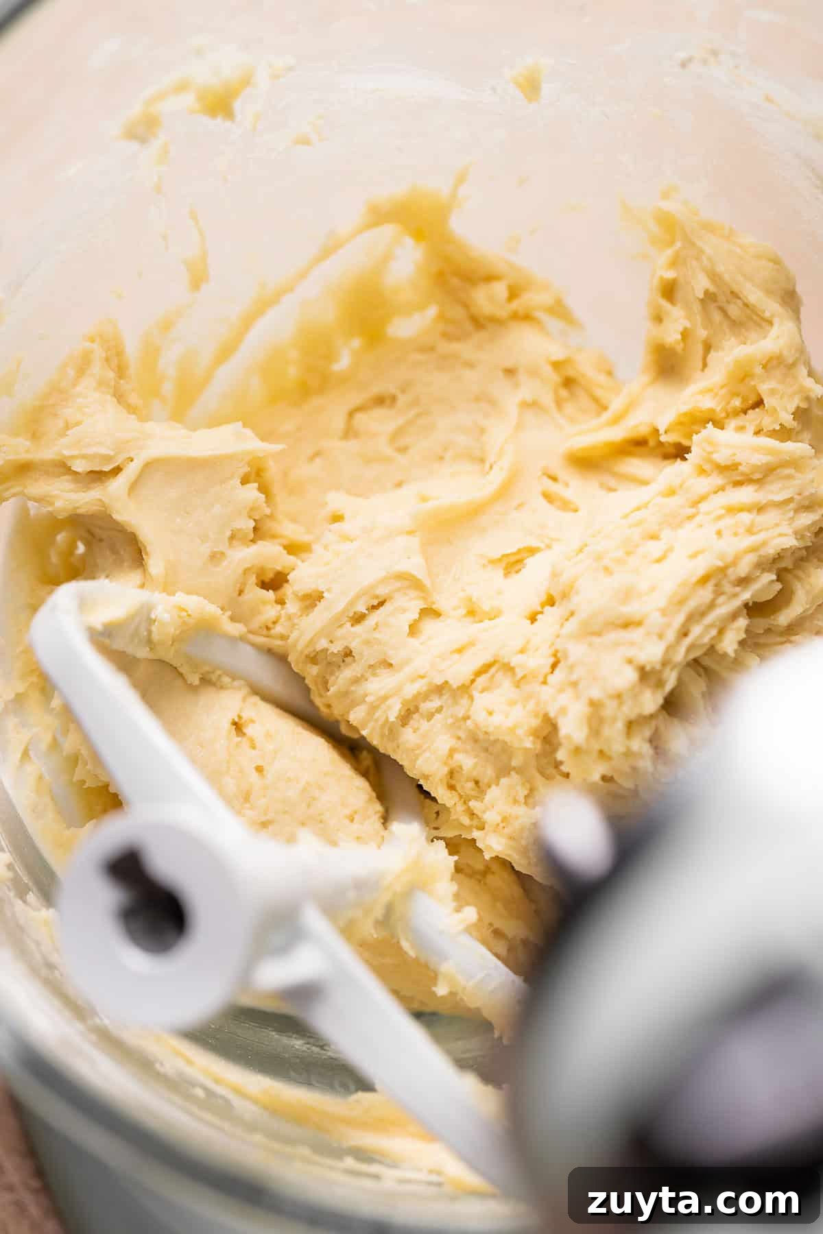 Pumpkin Cheesecake Cookies Recipe 7 A glass mixing bowl with the cream cheese cookie dough.
