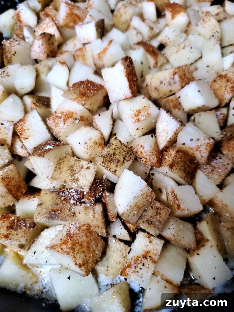 Crispy Skillet Breakfast Potatoes Recipe 2 cubed potatoes in cast iron skillet