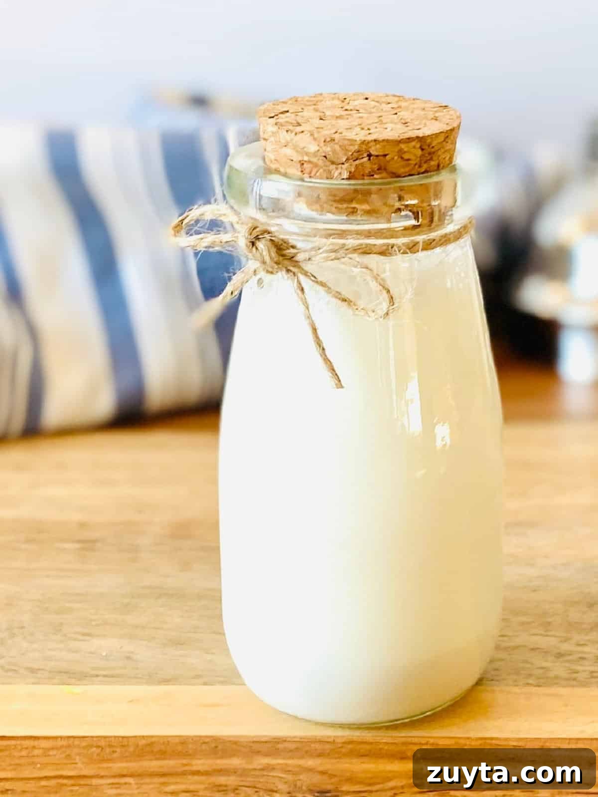 What to Use Instead of Sweetened Condensed Milk 2 jar with cork containing sweetened condensed milk substitute.