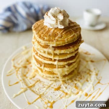 What to Use Instead of Sweetened Condensed Milk 3 tres leches pancakes on a plate drizzled with tres leches syrup, caramel dulce de leche and whipped cream