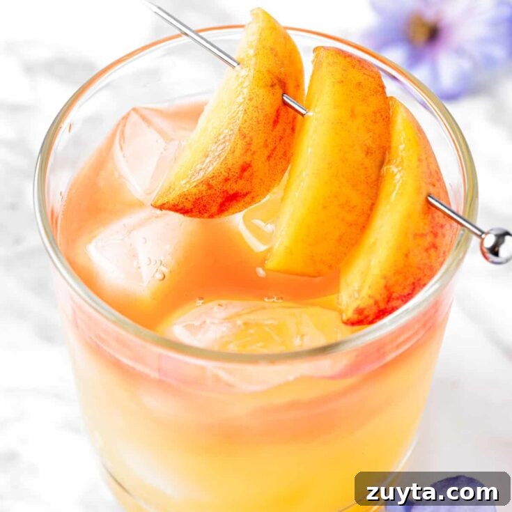 Overhead view of a georgia peach drink garnished with peach slices.