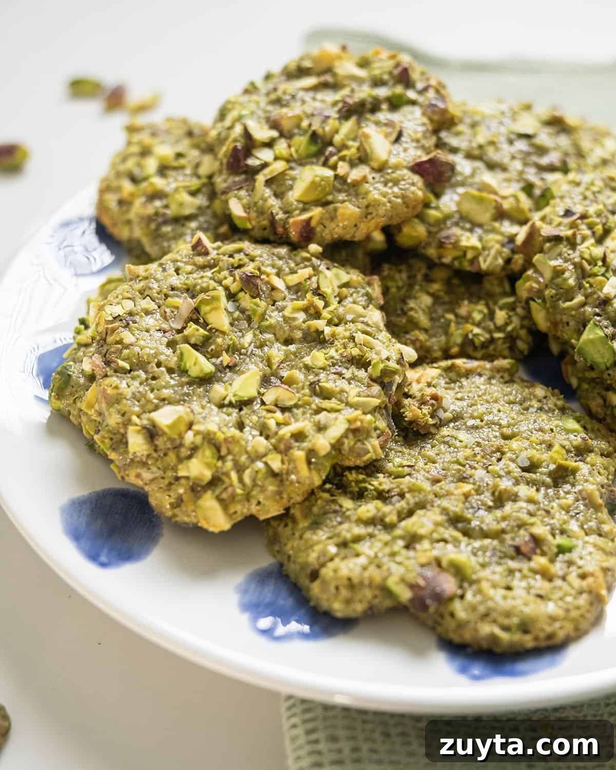Classic Italian Pistachio Cookies Recipe 9 Italian pistachio cookies on a plate.