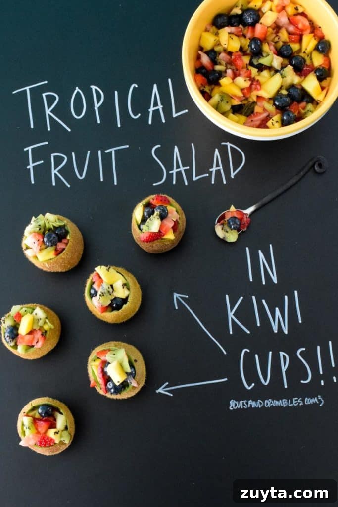 Tropical Fruit Salad in Kiwi Cups Recipe 2 Tropical Fruit Salad in Kiwi Cups with title written on black chalkboard