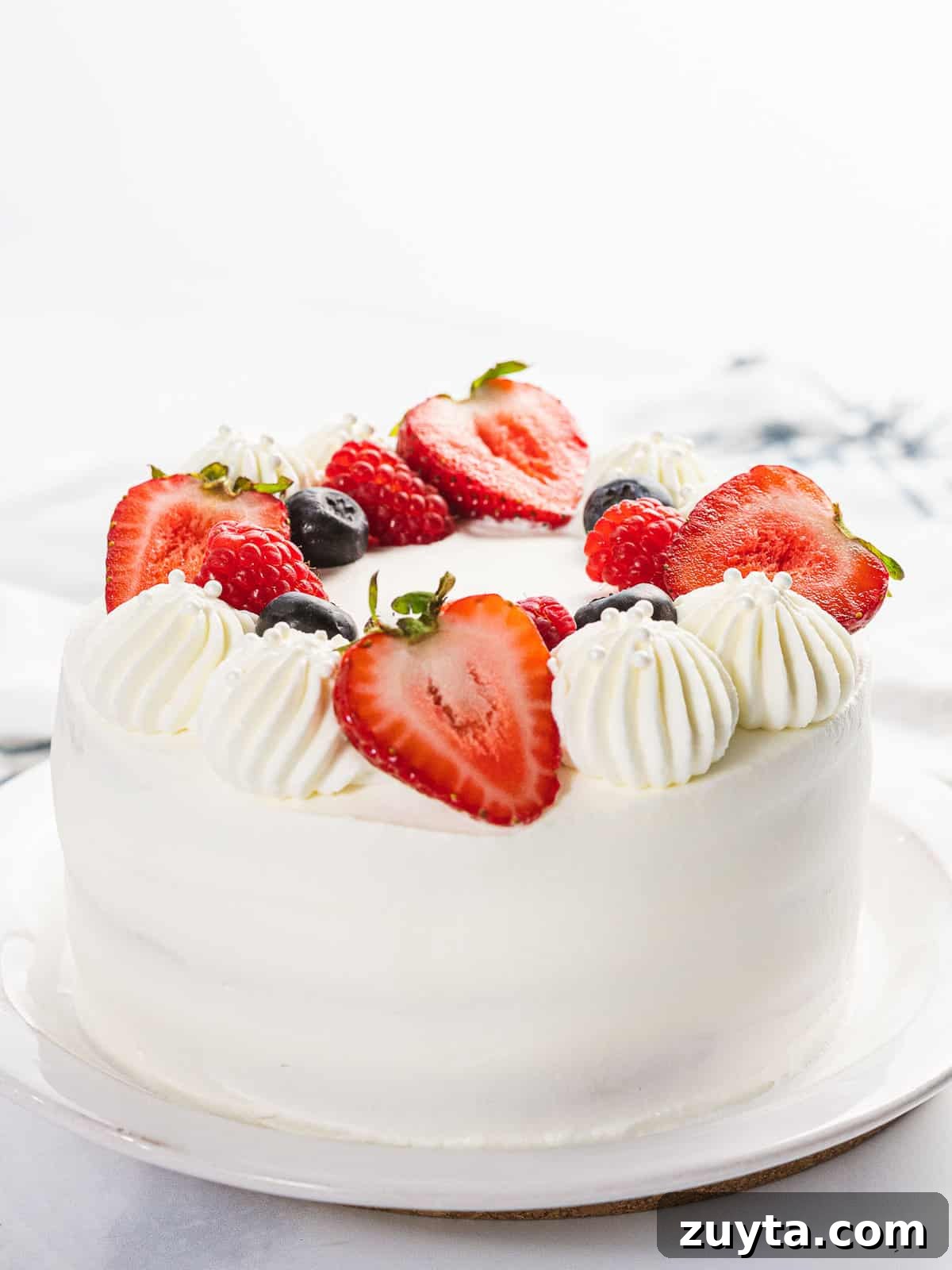 Fluffy Chantilly Cake with Fresh Berries Recipe 11 Fluffy berry Chantilly cake with strawberries, blueberries, and Chantilly cream.