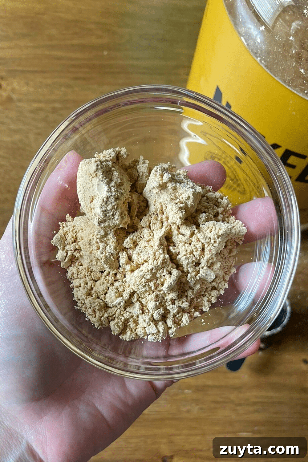 Naked Nutrition Review: Top 3 Protein Powders Compared 8 Nutritious peanut butter protein powder in a small bowl, a protein-packed delight for your healthy recipes and smoothies.