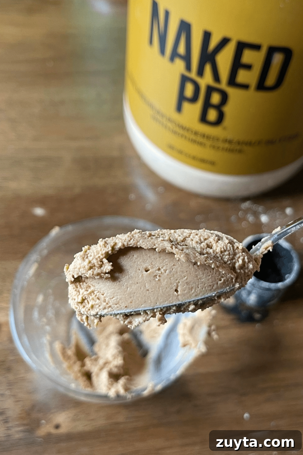 Naked Nutrition Review: Top 3 Protein Powders Compared 9 Whipped and fluffy homemade peanut butter made from peanut butter protein powder, a delectable and nutritious treat.