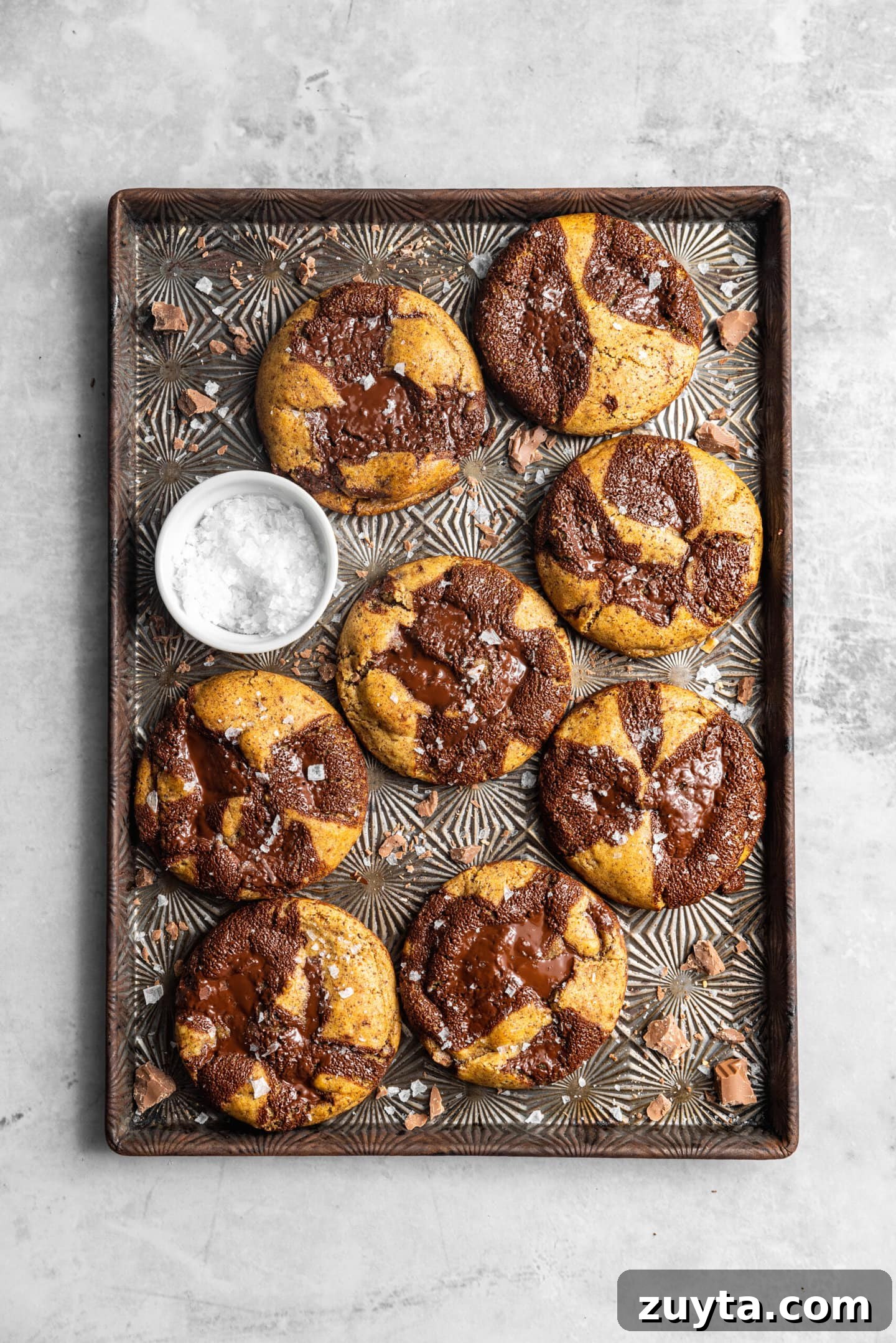 Small-Batch Brown Butter Chocolate Chip Cookie Recipe 12 Fresh baked Small Batch Brown Butter Chocolate Chip Cookies on baking sheet with flaky salt