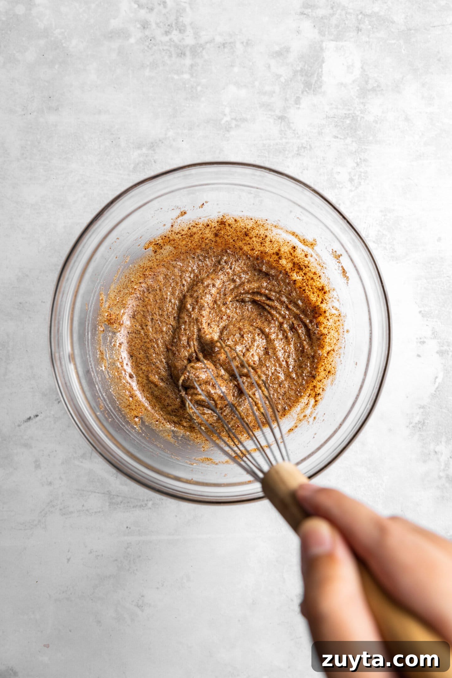 Small-Batch Brown Butter Chocolate Chip Cookie Recipe 8 Egg and vanilla being whisked into brown butter mixture