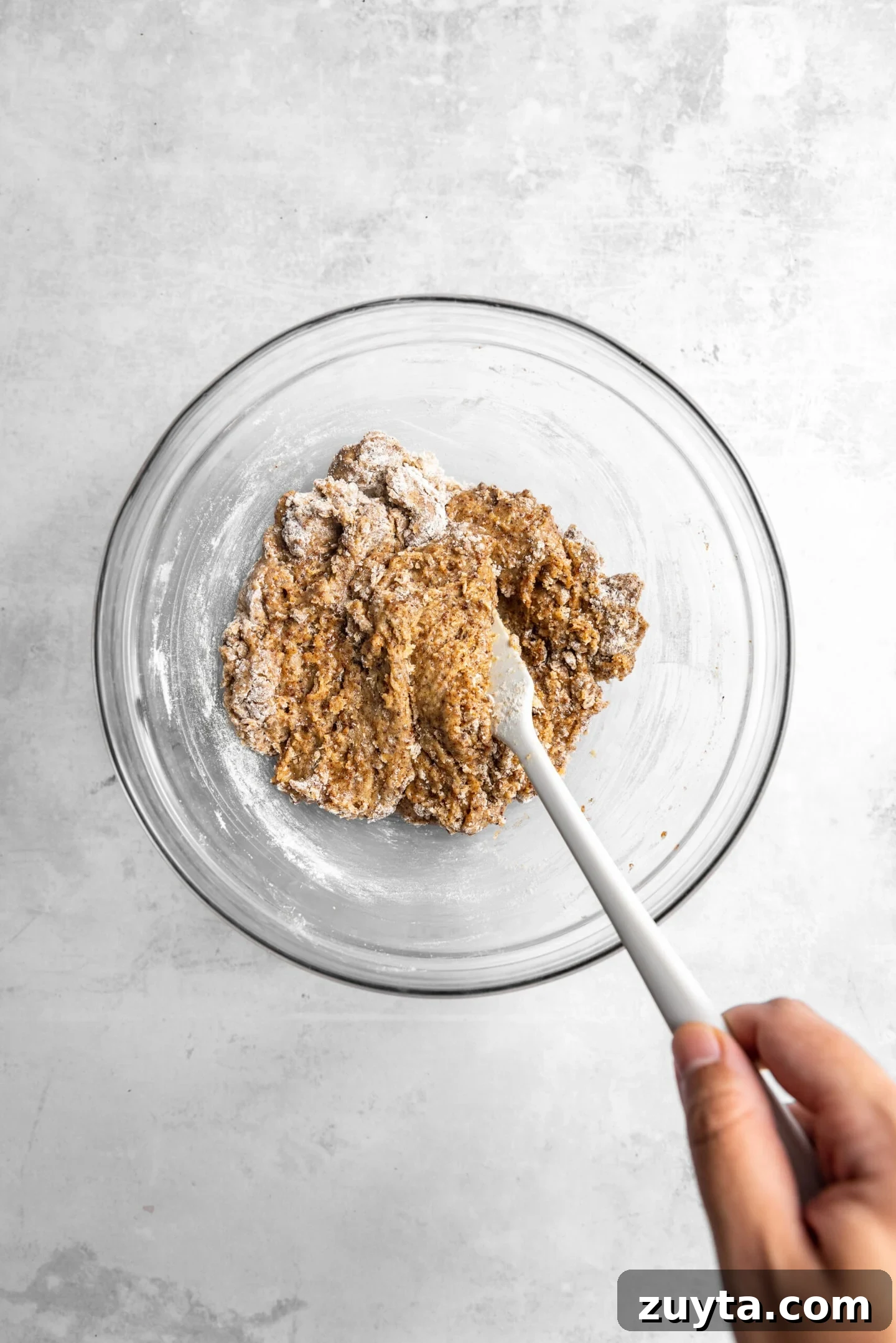 Small-Batch Brown Butter Chocolate Chip Cookie Recipe 9 Dry ingredients being stirred into wet ingredients to form cookie dough