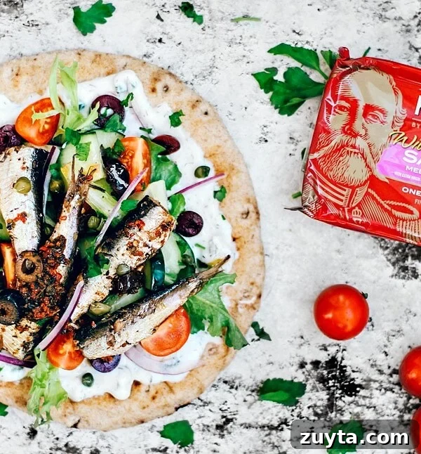 Pita topped with tzatziki, fresh veggies, and Mediterranean sardines.