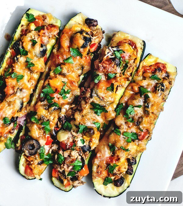 Tex Mex stuffed zucchini boats on a platter.