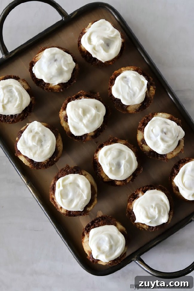 one dozen gluten-free cinnamon roll muffins on platter