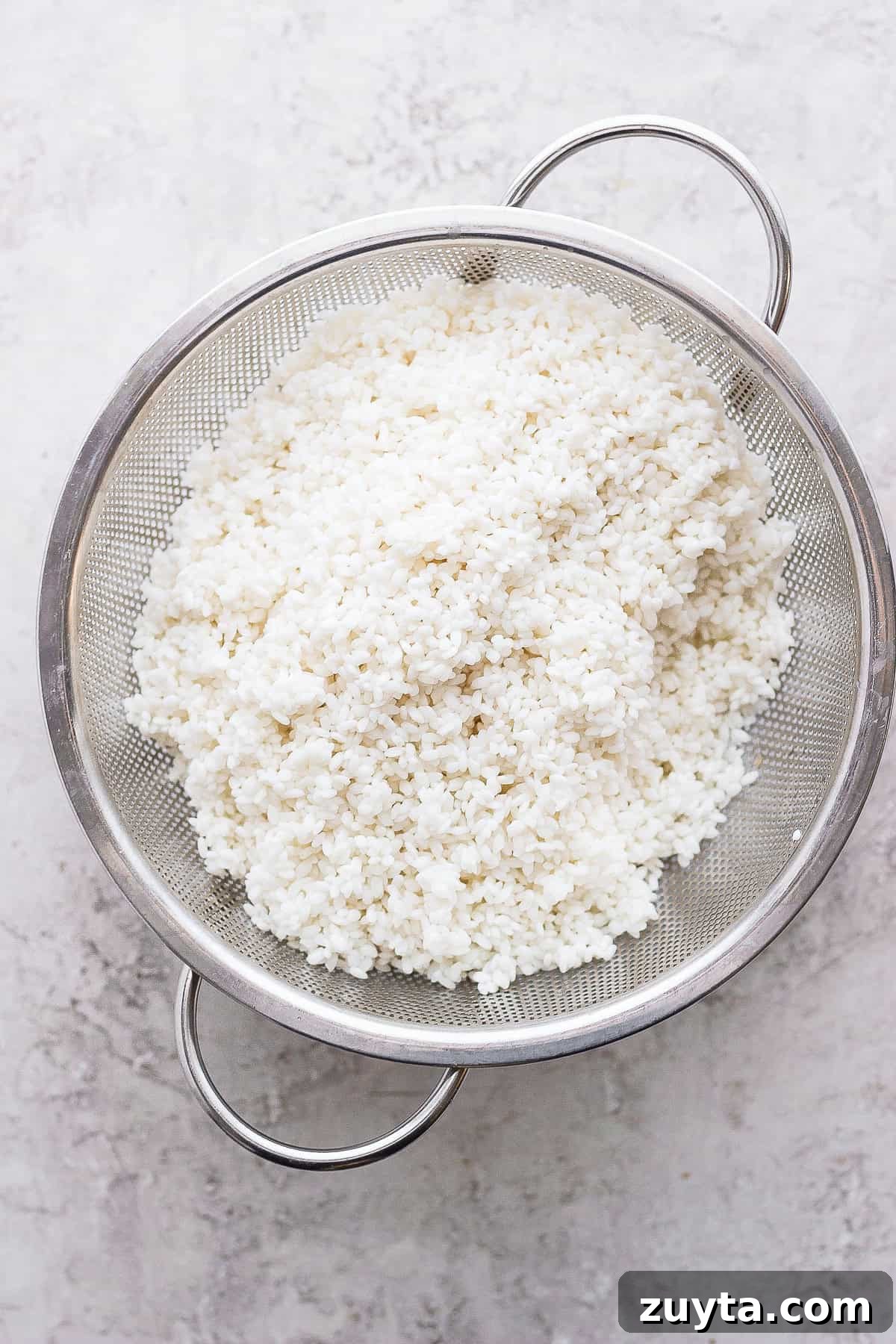 Sticky rice in a strainer sticky rice in a strainer