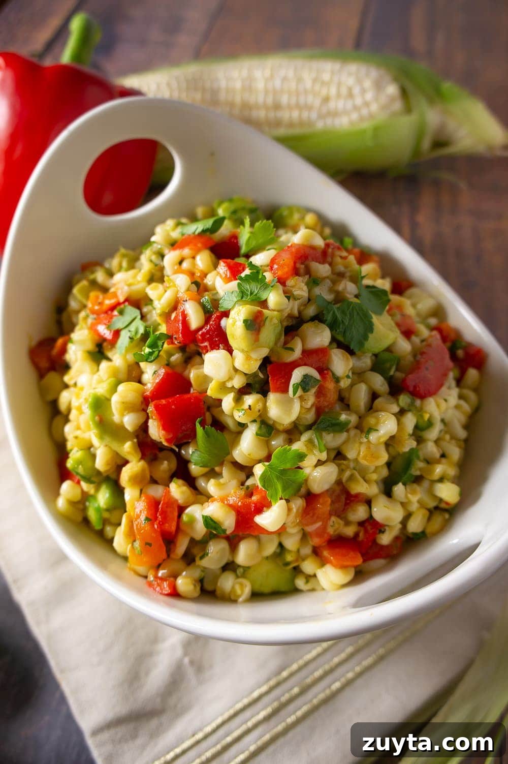 Hot Dog Bar Ideas: Toppings, Themes and Party Setup 11 a serving bowl of avocado corn salad.