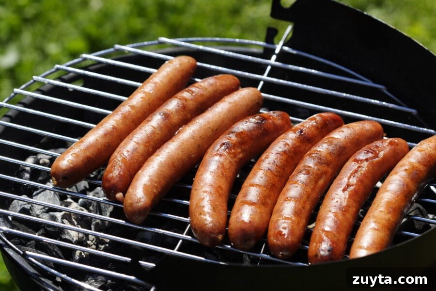 Hot Dog Bar Ideas: Toppings, Themes and Party Setup 3 hot dogs on a grill.