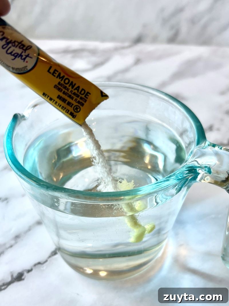 Virgin Mojito Recipe: Mint and Lime Mocktail 4 Crystal light lemonade mixed with water in a measuring cup.