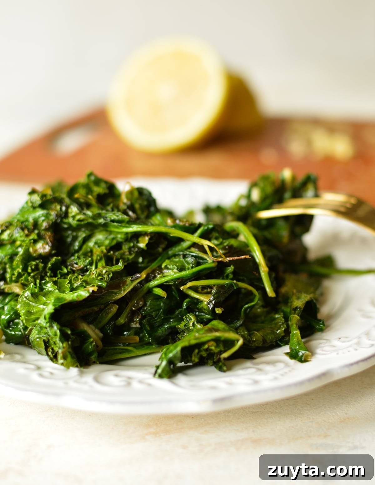 10-Minute Sauteed Kale and Spinach Recipe 2 a plate of sauteed spinach and kale.