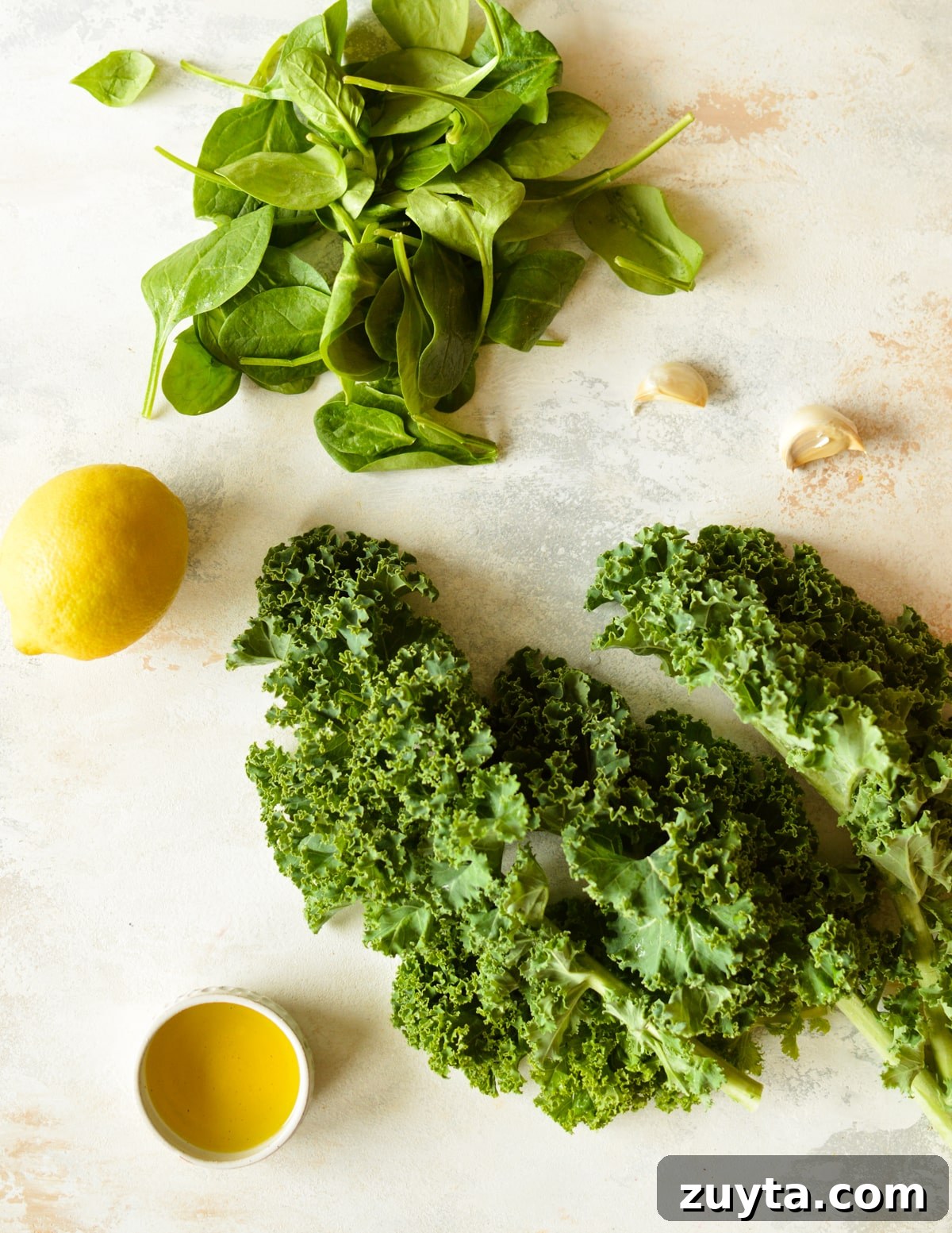 10-Minute Sauteed Kale and Spinach Recipe 3 spinach, kale, lemon, and garlic cloves.