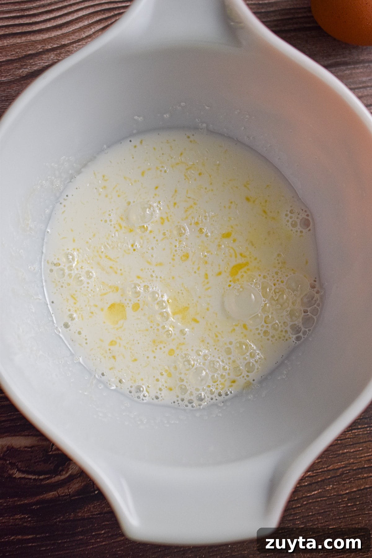 Single-Serving Fluffy Pancakes for One 3 The milk, sugar, and melted butter are mixed together in a large bowl.