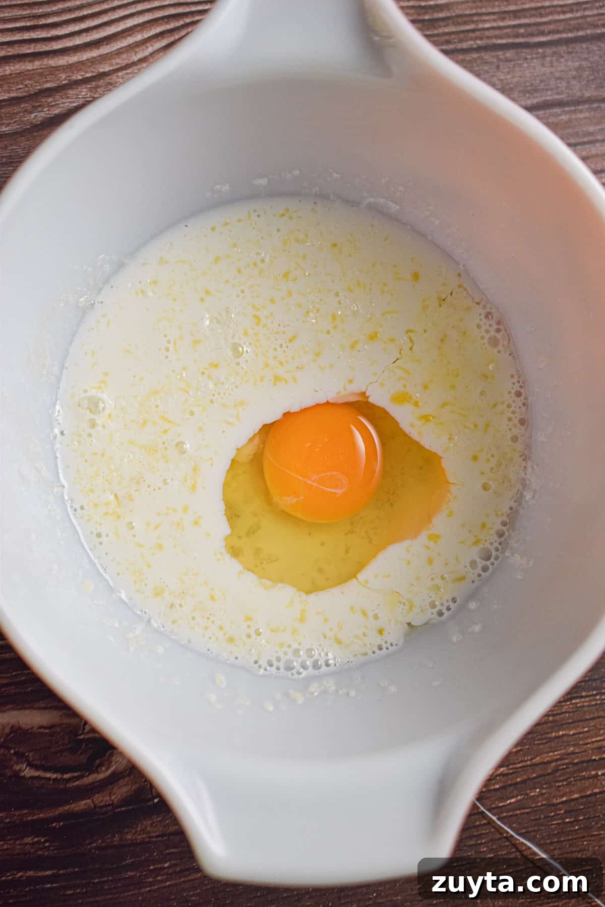 Single-Serving Fluffy Pancakes for One 4 The egg is added to the large bowl.