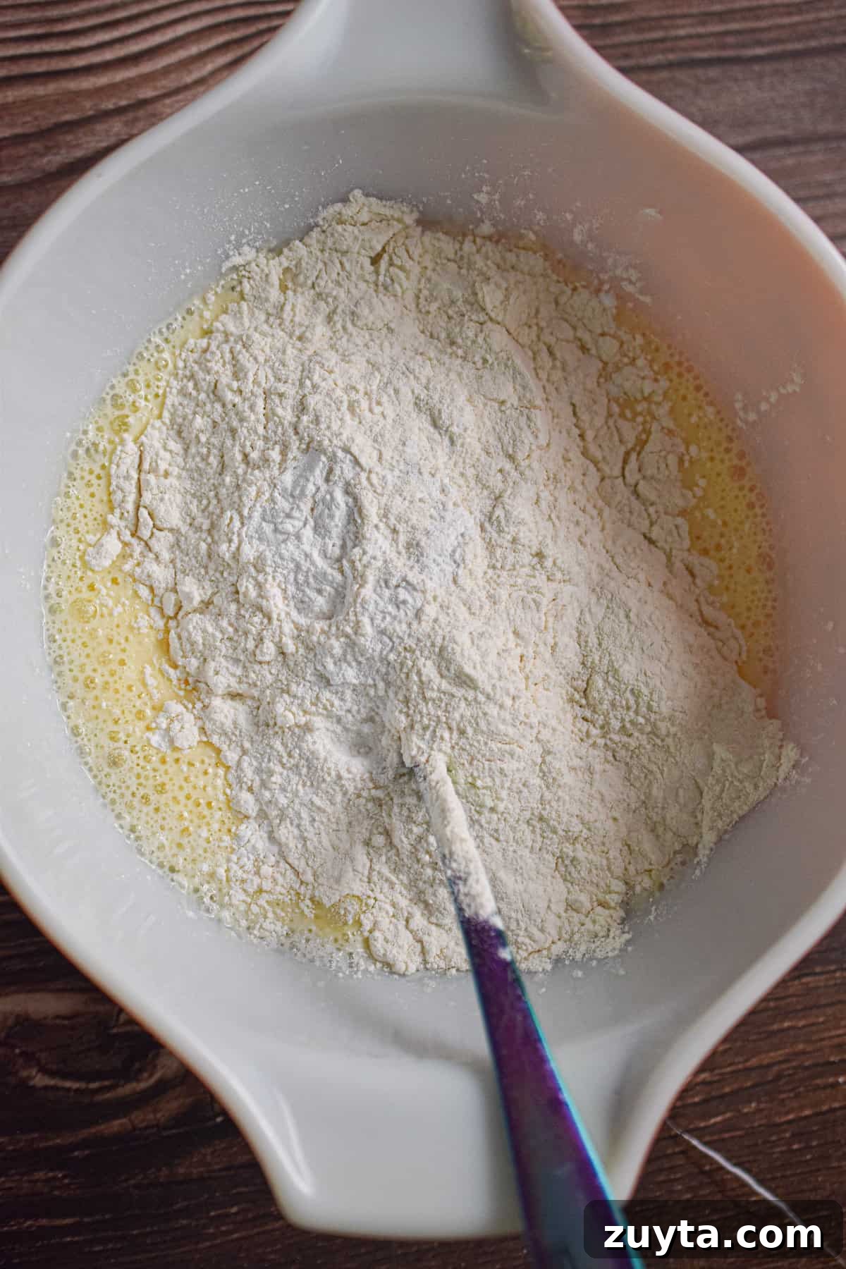 Single-Serving Fluffy Pancakes for One 5 The dry ingredients are added to the wet ingredients.
