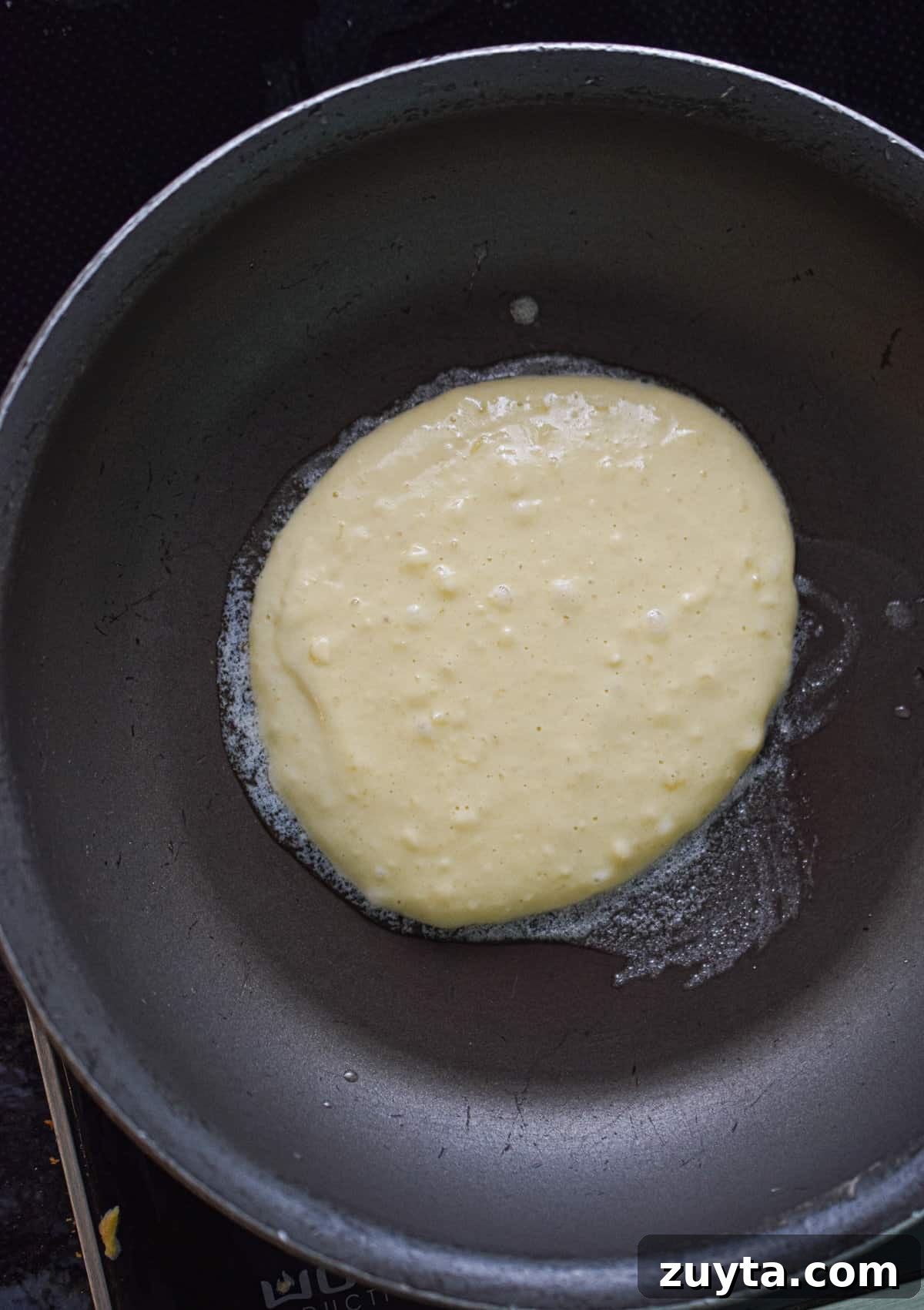 Single-Serving Fluffy Pancakes for One 6 The pancake batter is in a large skillet.