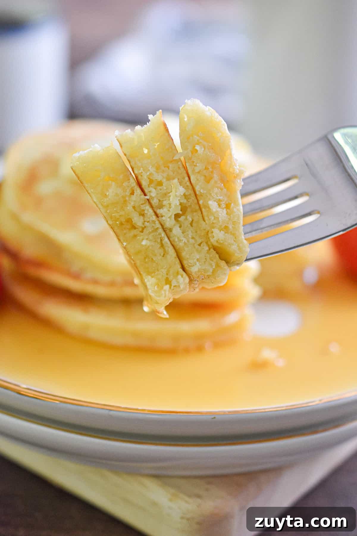 Single-Serving Fluffy Pancakes for One 8 A slice of the pancakes is being held by a fork.