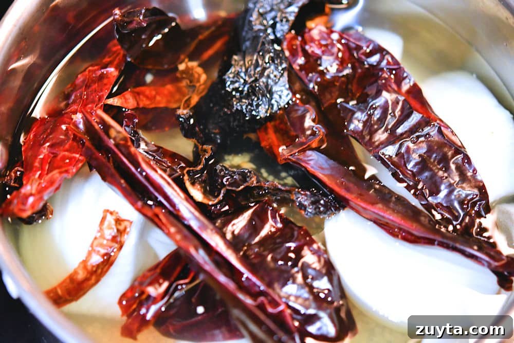 Authentic Guajillo Chile Sauce Recipe 8 guajillo peppers in a medium saucepan to simmer