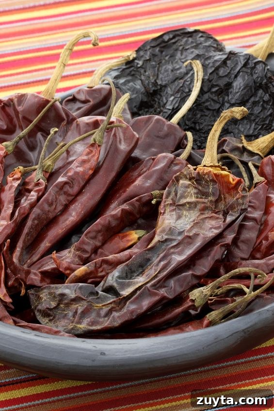 Authentic Guajillo Chile Sauce Recipe 6 clay bowl with guajillo and ancho chiles