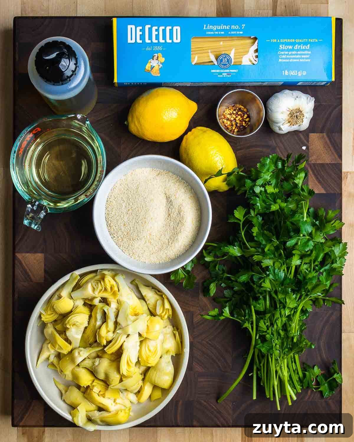 Artichoke Pasta with Crispy Breadcrumbs 3 Ingredients: linguine, olive oil, lemons, white wine, parsley, garlic, breadcrumbs, and artichoke hearts.