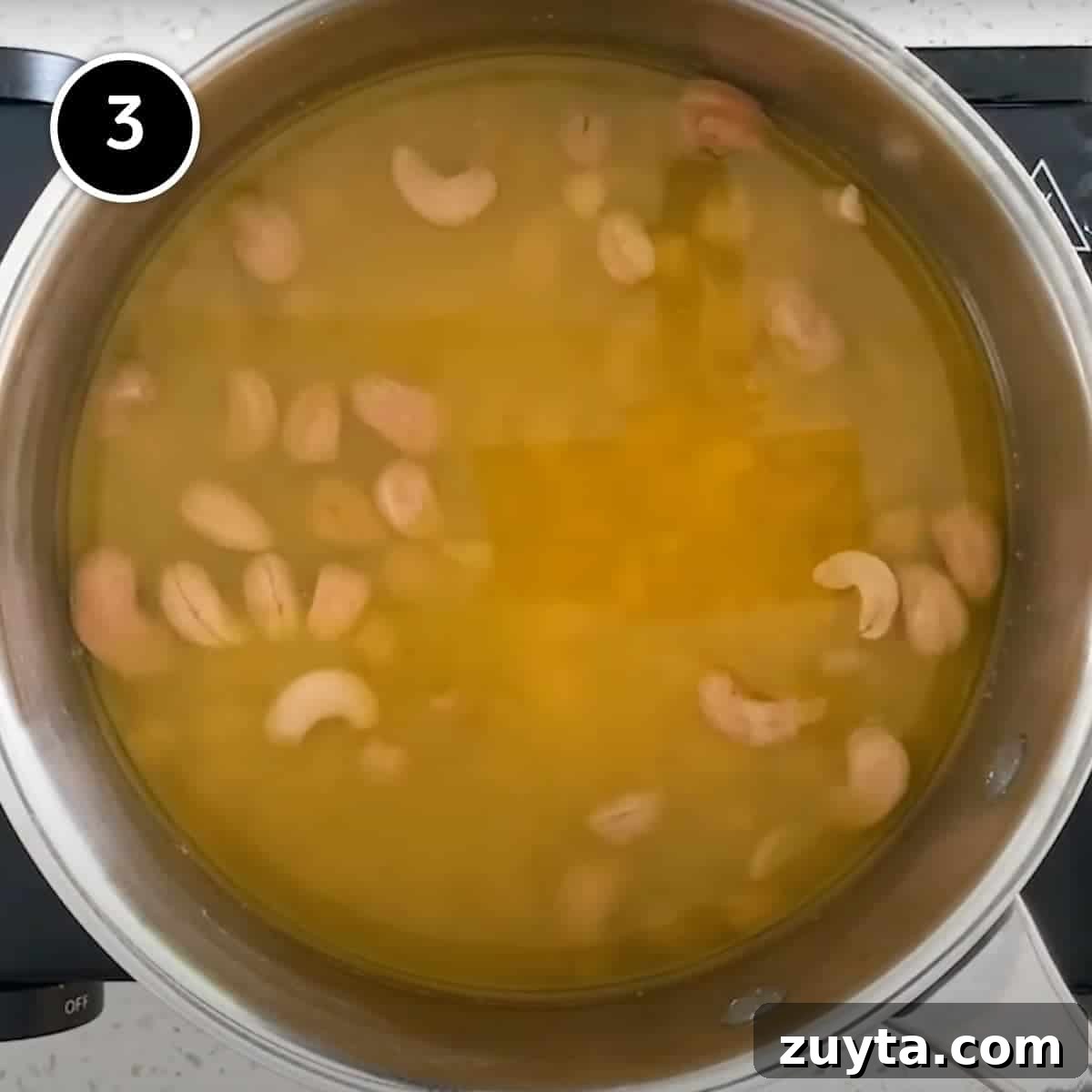 Authentic Sri Lankan Cashew Curry (Kaju Maluwa) Recipe 6 Cooking cashew nuts with turmeric