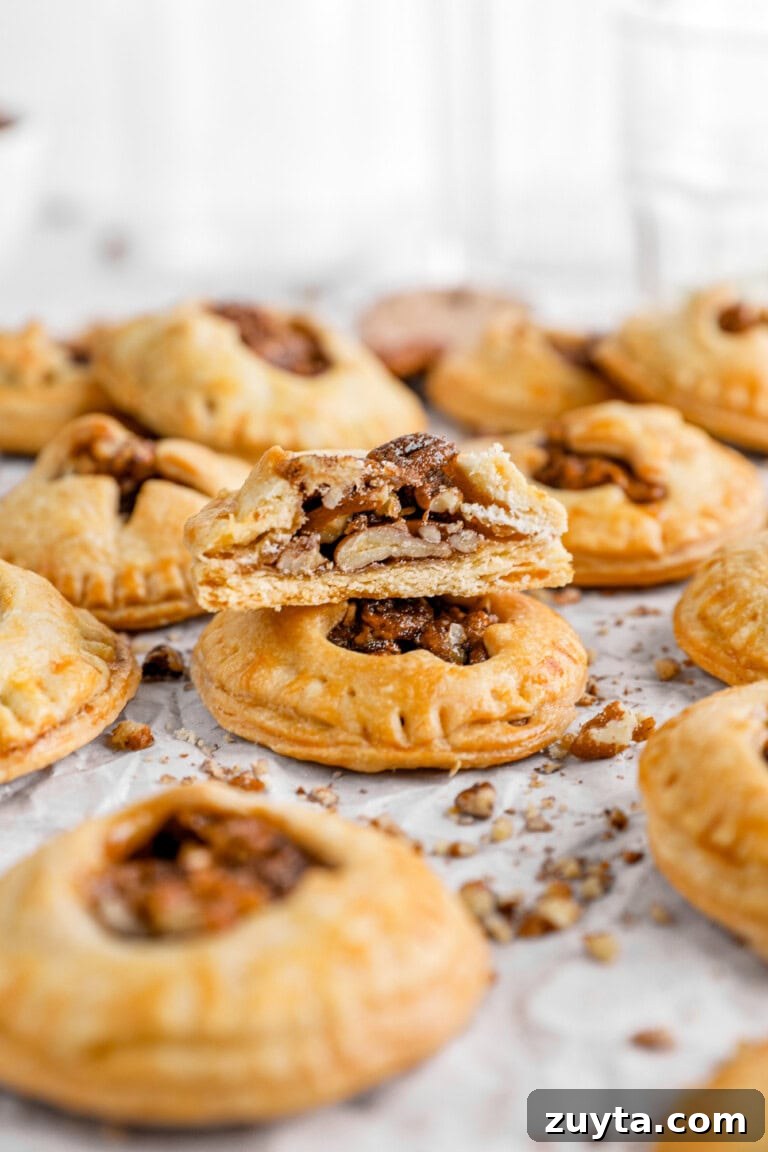 half of pecan hand pie with more hand pies around.