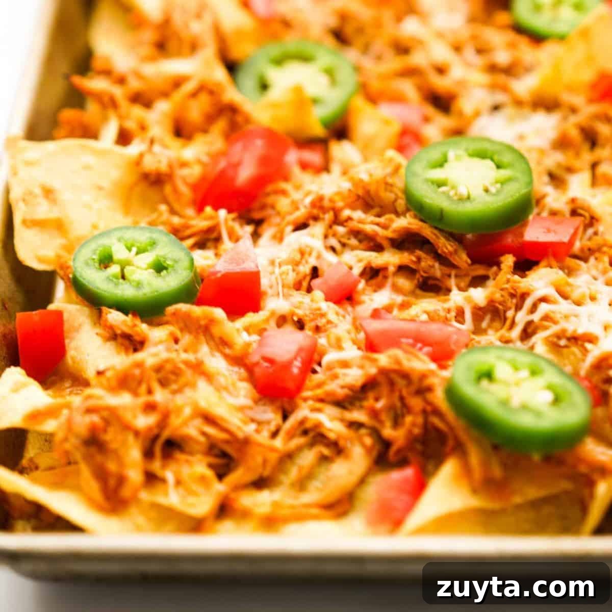 Sheet Pan Dinner Recipes for Quick Weeknight Meals 19 Baked nachos on a sheet pan.
