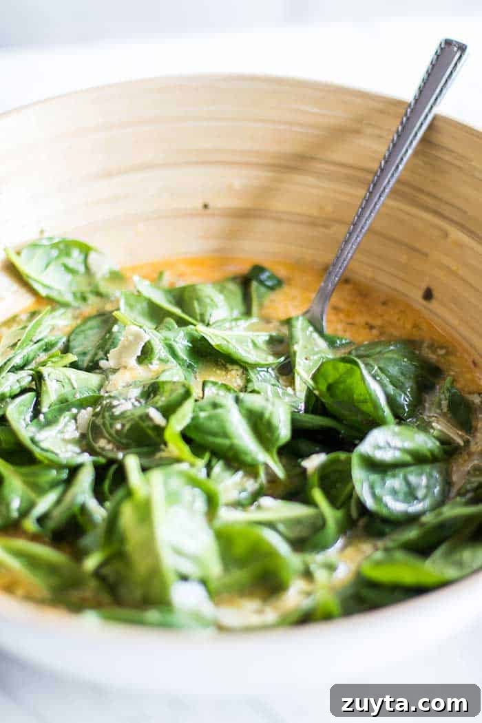 Sweet Potato and Spinach Frittata Recipe with Caramelized Onions 4 A bowl full of egg and spinach mixture.
