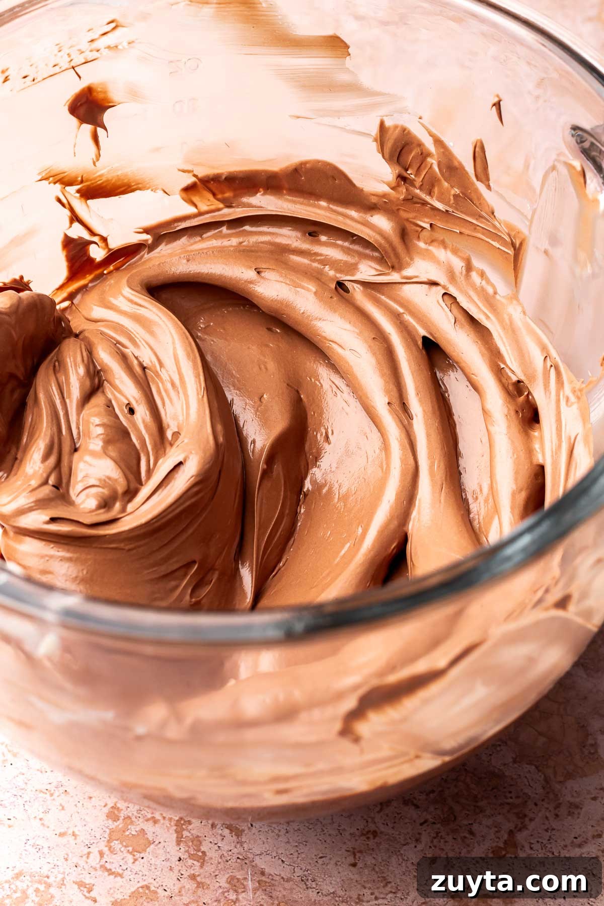Silky Chocolate Swiss Meringue Buttercream Recipe 2 A bowl of chocolate swiss meringue buttercream.