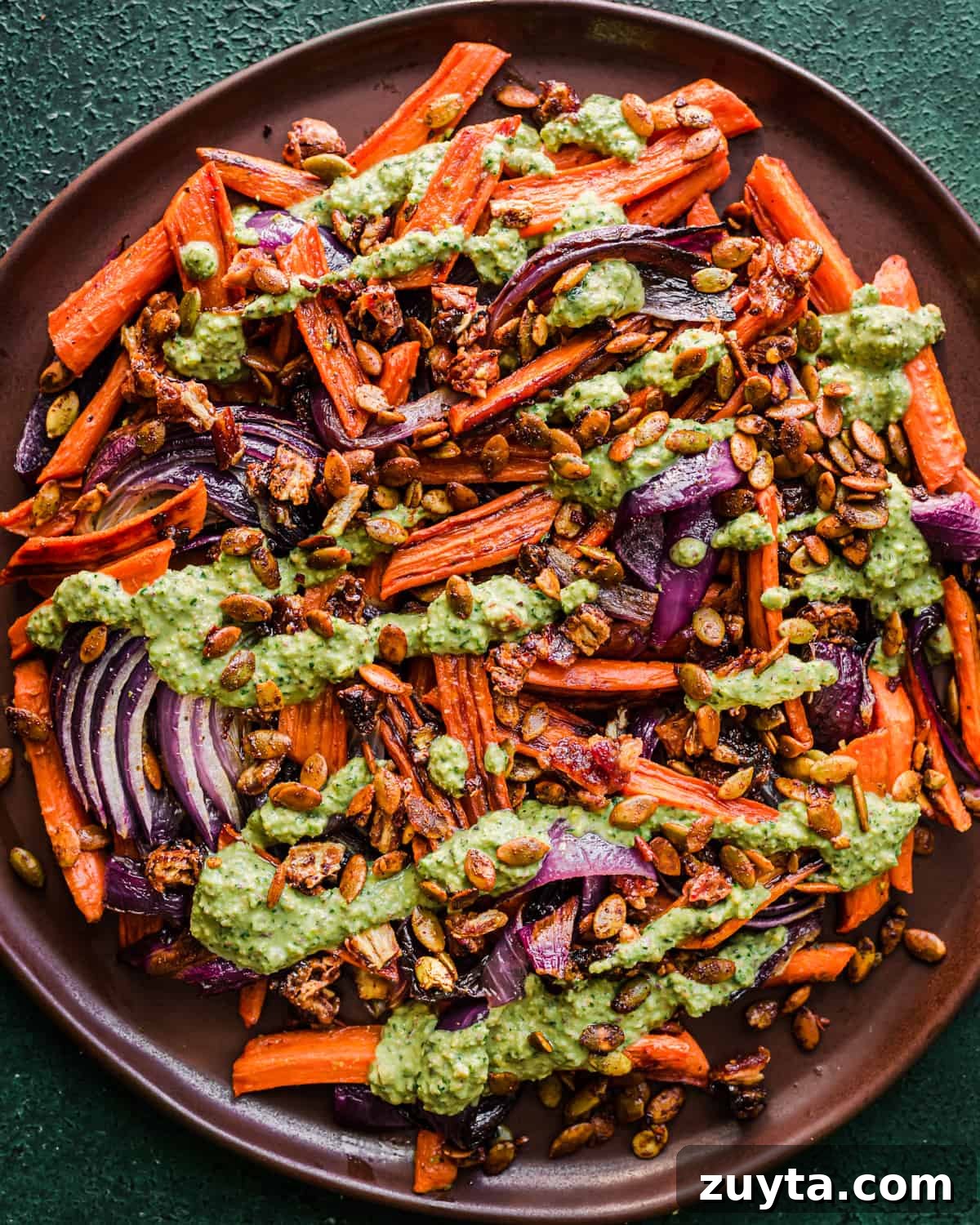 Maple-Roasted Carrots and Dates with Pistachio Pesto 13 Seed sprinkle added on top of dish.