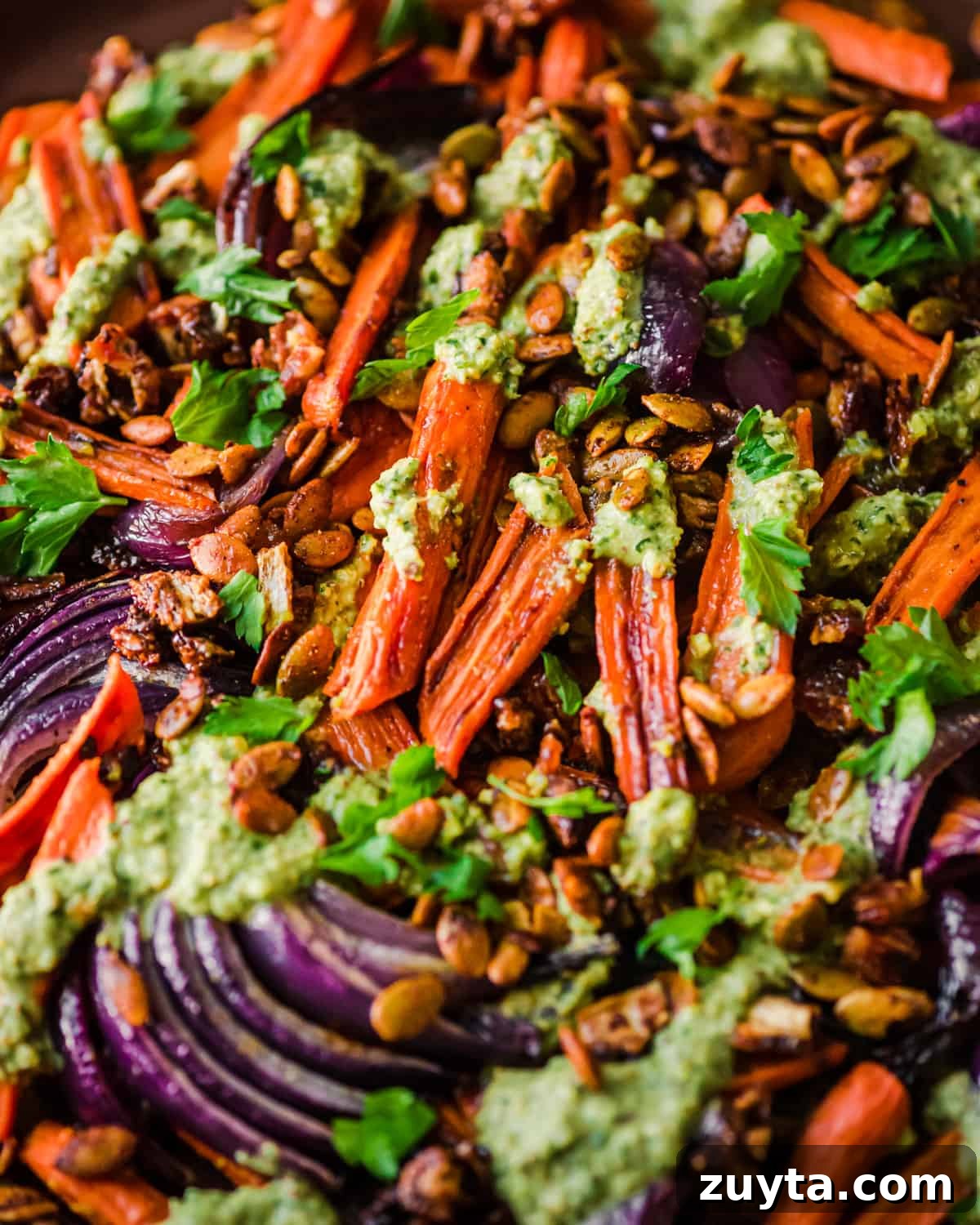 Maple-Roasted Carrots and Dates with Pistachio Pesto 2 Close up photo of finished carrots and dates dish.