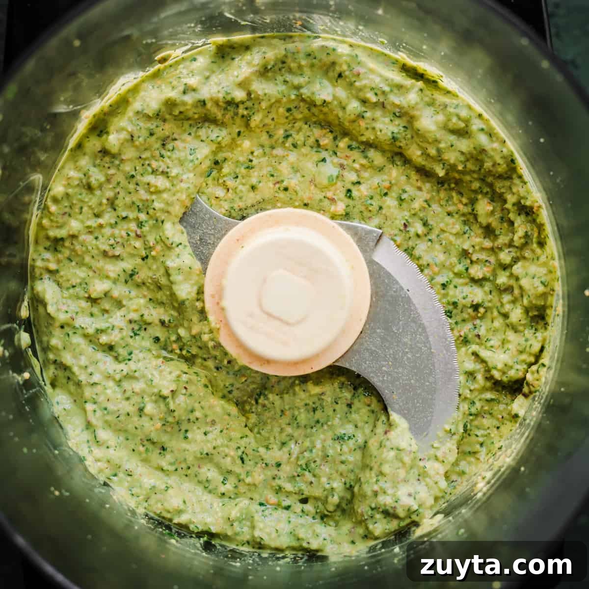 Maple-Roasted Carrots and Dates with Pistachio Pesto 8 Pistachio pesto ingredients in a blender after being blended.