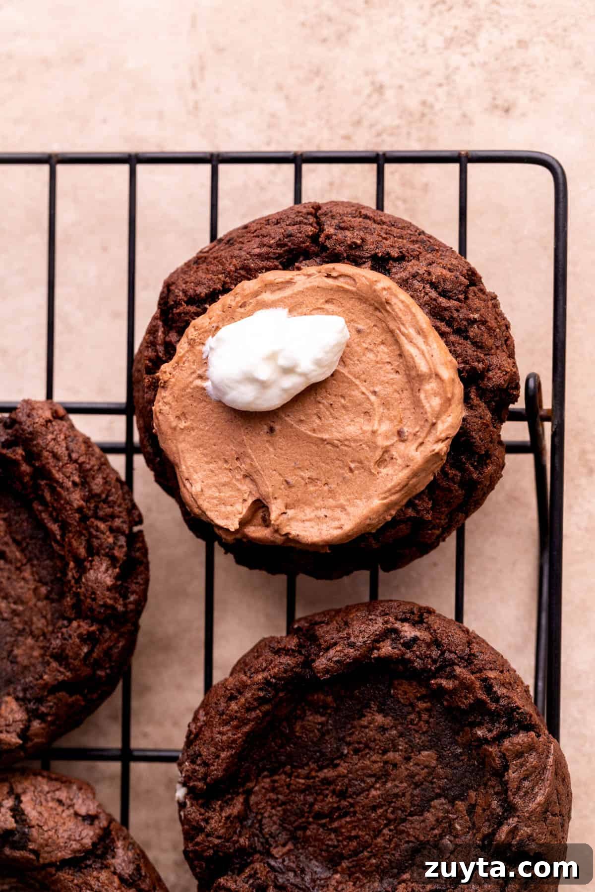 Whipped cream on top of cookie.